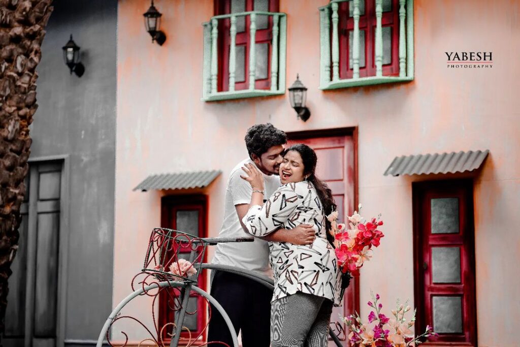 A loving couple posing in stylish and well-coordinated outfits during their pre-wedding photoshoot, showcasing their unique fashion sense and connection.